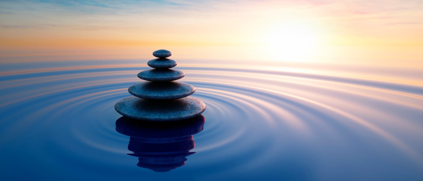 Zen stones at sunset